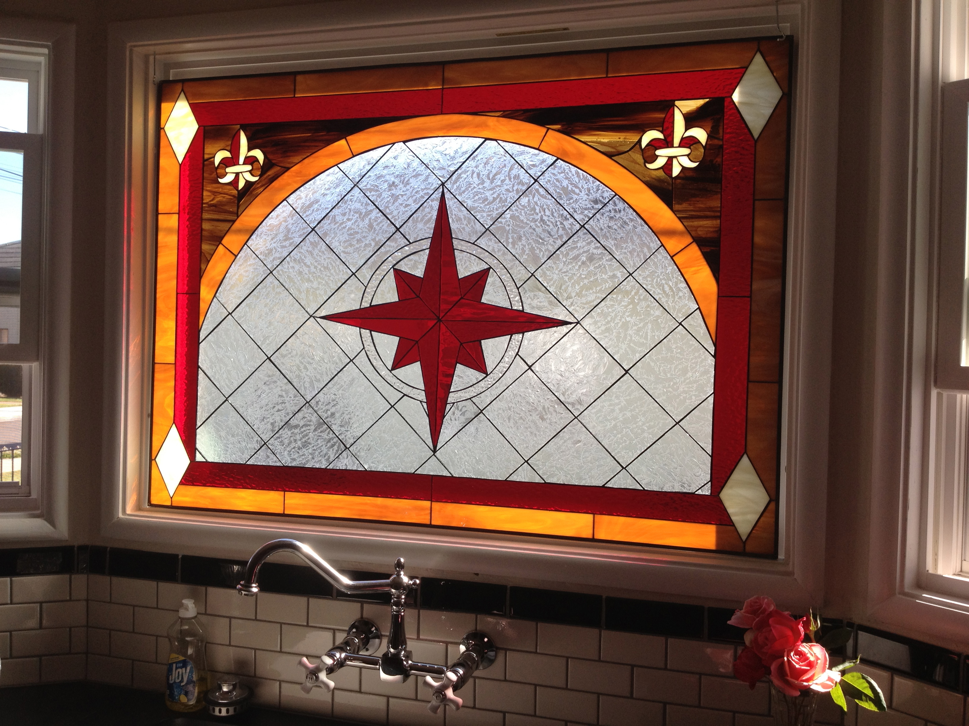 stained glass window over kitchen sink